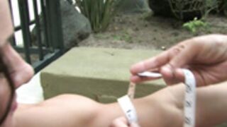 Wonder woman Erica measuring her Biceps 2