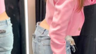 Mastrubating in dressing room.