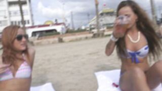Double topless beach interview
