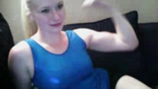 Cute blond gymnast flex her biceps
