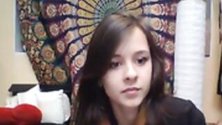 Beautiful European girl tries on revealing maid outfit