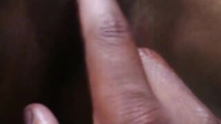 Man oils his DESI GF, fingers her pussy making her moan
