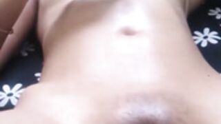 Man oils his DESI GF, fingers her pussy making her moan