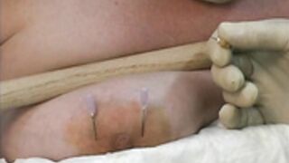 Nipple piercing with needle