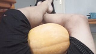 Woman crushes several fruits betwen her thighs