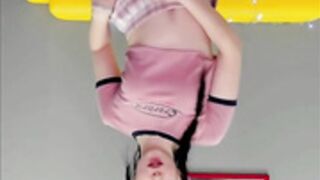 flirty cutie dancing in miniskirt with pigtails