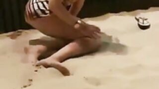 horny teen masturbating on a public beach