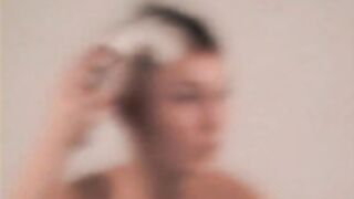 sexy nude pixie haired Brunette shaves smooth bald