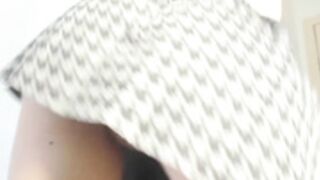 She opens pussy and ass in a short skirt