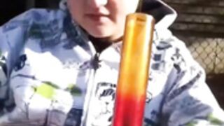 Two girls smoke bong