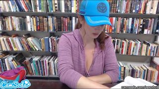 Lovely redhead gets dirty in library