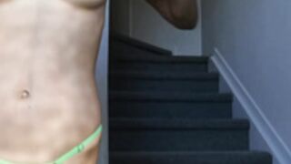Alice showing off her goods in a green bikini