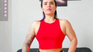 very muscular girl flexing