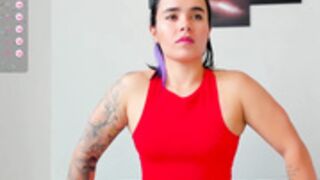 very muscular girl flexing