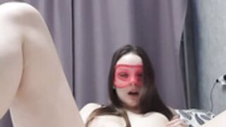 Girl with mask rubs right pussy