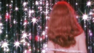 Cassandra Peterson (Elvira burlesque strip)