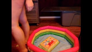 Adrey sits on a cake then covers herself in chocolate