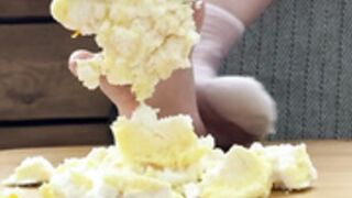 _temikmiu_ destroying a cake with her feet