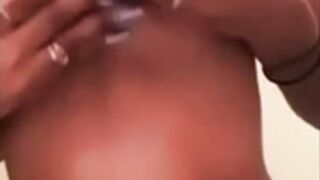 Girl plays with her round tits