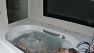 Sara and her boyfriend have fun in jacuzzi