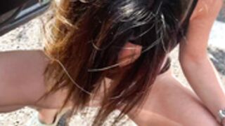 Priscilla piss beside the car