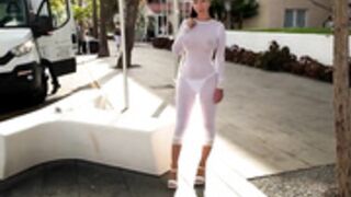 Naughty Lada walk in the city wearing see trough dress