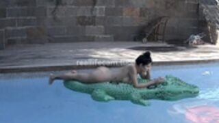 Margo and BF sunbathe naked in the pool
