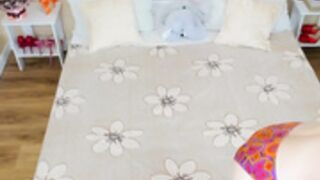 Foxy Sophie casually on her bed