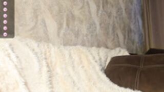 Watch cam model on white blanket