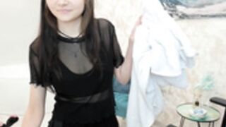 Jenderik having a shower, fully clothed