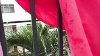 Dianita_1988 squirts on people from her balcony part 1