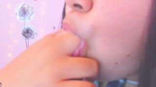 camgirl sucks on her fingers