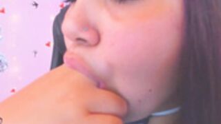 camgirl sucks on her fingers
