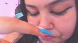 camgirl sucks on her fingers