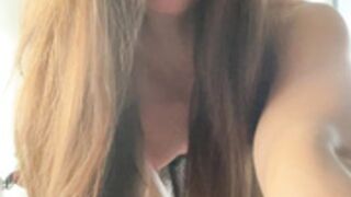 Fmale bodybuilder in micro skirt flexing biceps