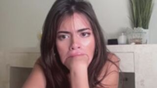 pouty selena whole fist in mouth