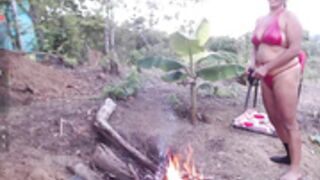 Andre naked at the campfire