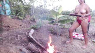 Andre naked at the campfire