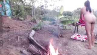 Andre naked at the campfire