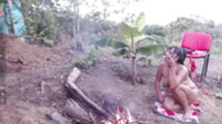 Andre naked at the campfire
