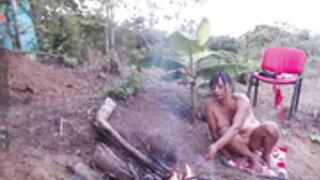 Andre naked at the campfire