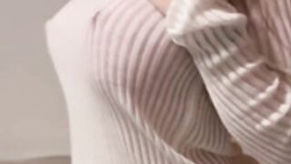 hailey queen wearing a white sweater