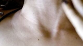Shows her neck veins while lying down