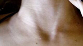 Shows her neck veins while lying down