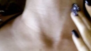 Shows her neck veins while lying down