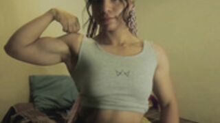 v10 flexing her biceps