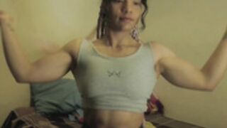 v10 flexing her biceps