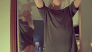 Ocicat nude in front of the mirror