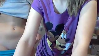 Two girls are shoving each other's fingers in the ass