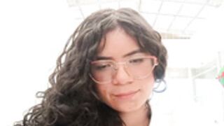 Simone Miller in a public bathroom